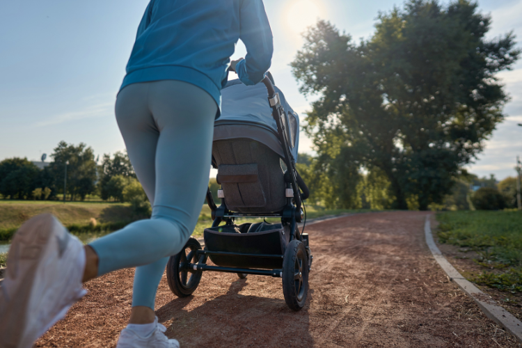 A person running with a pushchair. What to pack for a motorhome holiday